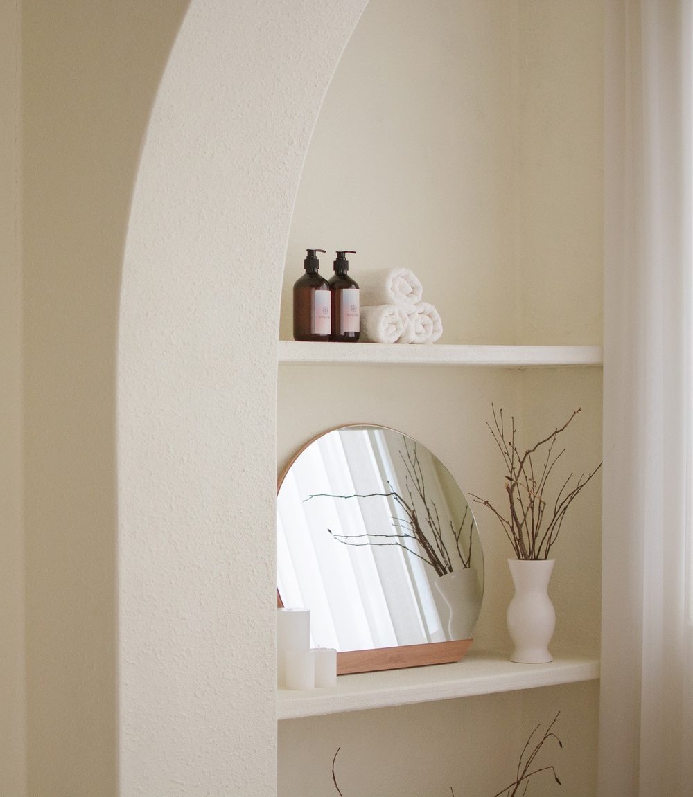 Serene bathroom shelf styling detail